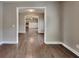 Inviting living room showcasing hardwood floors, neutral paint, and seamless flow into other areas at 1820 Cobblefield Cir, Dacula, GA 30019