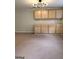 Finished basement features carpeted flooring and plenty of cabinet storage at 1581 Shetland Pony Nw Ct, Suwanee, GA 30024