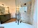 Spacious bathroom with tile shower, glass door, and double vanity at 1581 Shetland Pony Nw Ct, Suwanee, GA 30024