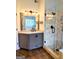 Bathroom features a granite countertop, shower with glass doors and a rain-style shower head at 1581 Shetland Pony Nw Ct, Suwanee, GA 30024