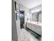 Bright bathroom features a double sink vanity and a shower with a curtain at 1581 Shetland Pony Nw Ct, Suwanee, GA 30024