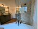 Bright bathroom boasts double vanities and a spacious walk-in shower with decorative stone walls at 1581 Shetland Pony Nw Ct, Suwanee, GA 30024