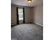Inviting bedroom with plush carpeting, a cozy atmosphere, and natural light from the window at 1581 Shetland Pony Nw Ct, Suwanee, GA 30024