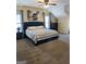 Large bedroom with vaulted ceilings, large windows, and neutral carpet at 1581 Shetland Pony Nw Ct, Suwanee, GA 30024