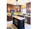 Gourmet kitchen featuring stainless steel appliances, granite countertops, and a stylish island at 1581 Shetland Pony Nw Ct, Suwanee, GA 30024