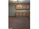 Comfortable room with cabinets and carpet flooring is a blank canvas to create your perfect space at 1581 Shetland Pony Nw Ct, Suwanee, GA 30024