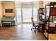 Bright home office with a large bay window, hardwood floors, and ample workspace at 1581 Shetland Pony Nw Ct, Suwanee, GA 30024