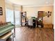 Bright home office with a large bay window, hardwood floors, and ample workspace at 1581 Shetland Pony Nw Ct, Suwanee, GA 30024