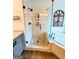Bathroom shower features tile surround and glass door, accompanied by a soaking tub at 1581 Shetland Pony Nw Ct, Suwanee, GA 30024