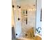 Bathroom shower features tile surround and glass door at 1581 Shetland Pony Nw Ct, Suwanee, GA 30024