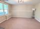 Room with carpet and natural light with large window is ready for you to decorate and move in at 1581 Shetland Pony Nw Ct, Suwanee, GA 30024
