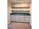 Finished room features built-in cabinets and shelving for storing glasses and other collectibles at 1581 Shetland Pony Nw Ct, Suwanee, GA 30024
