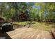 Beautiful backyard with a wooden deck, steps to the lawn, and fenced perimeter, ideal for relaxation and entertainment at 1252 Heritage Dr, Villa Rica, GA 30180