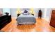 Bedroom features hardwood floors, gray paint, white trim, and a modern style at 1252 Heritage Dr, Villa Rica, GA 30180