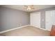 Clean bedroom featuring neutral walls, carpeted floor, closet and a door at 1252 Heritage Dr, Villa Rica, GA 30180
