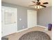 Bright bedroom features a ceiling fan, two doors, and a neutral palette, creating a cozy atmosphere at 1252 Heritage Dr, Villa Rica, GA 30180