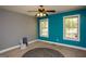 Relaxing bedroom featuring a ceiling fan, natural light from two windows, and a serene atmosphere at 1252 Heritage Dr, Villa Rica, GA 30180