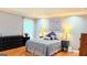 Open bedroom with ceiling fan, recessed lighting, and large windows at 1252 Heritage Dr, Villa Rica, GA 30180