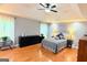 Open bedroom with ceiling fan, recessed lighting, and large windows at 1252 Heritage Dr, Villa Rica, GA 30180