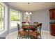 Sunlit breakfast nook features a view of the landscaped backyard at 1252 Heritage Dr, Villa Rica, GA 30180