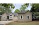 Well-maintained home featuring a charming facade, a manicured lawn, and a neatly paved driveway at 1252 Heritage Dr, Villa Rica, GA 30180