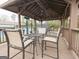 Charming gazebo with comfortable seating and view of the tennis courts for relaxing outdoors at 1252 Heritage Dr, Villa Rica, GA 30180