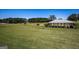 Expansive grounds with a covered picnic pavilion, lush green grass, and mature trees at 1252 Heritage Dr, Villa Rica, GA 30180