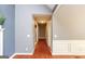 Hallway featuring hardwood floors and gray paint with white trim at 1252 Heritage Dr, Villa Rica, GA 30180