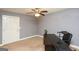 This home office features neutral walls, a ceiling fan, and a window for natural light to enhance productivity at 1252 Heritage Dr, Villa Rica, GA 30180