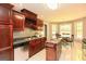Charming kitchen with an island, breakfast nook, and stainless appliances at 1252 Heritage Dr, Villa Rica, GA 30180