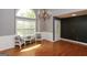 Elegant living room with hardwood floors, bright window, and chandelier at 1252 Heritage Dr, Villa Rica, GA 30180