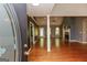 Open-concept living room with hardwood floors, fireplace, plenty of natural light, and neutral color palette at 1252 Heritage Dr, Villa Rica, GA 30180
