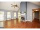 Bright living room features a fireplace, vaulted ceilings, and beautiful hardwood floors at 1252 Heritage Dr, Villa Rica, GA 30180
