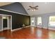 Spacious living room with hardwood floors, vaulted ceiling, and plenty of natural light at 1252 Heritage Dr, Villa Rica, GA 30180