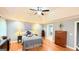 Spacious primary bedroom features a tray ceiling, recessed lighting, and hardwood floors at 1252 Heritage Dr, Villa Rica, GA 30180
