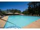 Inviting community pool with lounge chairs, umbrellas, and clear blue water for relaxing summer days at 1252 Heritage Dr, Villa Rica, GA 30180