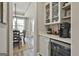 Cozy bar area with beverage refrigerator and plenty of storage at 608 White Cedar Ct, Peachtree City, GA 30269