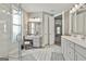 Bright bathroom with a vanity, stool, large mirror, and glass enclosed shower at 608 White Cedar Ct, Peachtree City, GA 30269