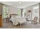 Comfortable bedroom with neutral tones, carpeted floors, and natural light at 608 White Cedar Ct, Peachtree City, GA 30269