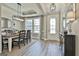 Dining room adjacent to the foyer with natural light and views of the entryway at 608 White Cedar Ct, Peachtree City, GA 30269