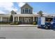 Exterior view of a building with white columns and a metal roof on a sunny day at 608 White Cedar Ct, Peachtree City, GA 30269