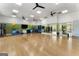 A bright exercise room with wood floors, exercise balls, yoga mats, and a mirrored wall at 608 White Cedar Ct, Peachtree City, GA 30269
