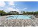 An outdoor swimming pool with a clear blue sky, seating, and trees surrounding at 608 White Cedar Ct, Peachtree City, GA 30269