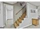 Finished basement features carpeted staircase and access to other rooms at 100 Rockland Trl, Sharpsburg, GA 30277