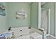 Bright bathroom features large soaking tub and separate shower at 100 Rockland Trl, Sharpsburg, GA 30277