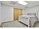 Basement bedroom features carpeted floors, a bed, and a closet at 100 Rockland Trl, Sharpsburg, GA 30277