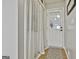 Bright entryway featuring a white door with glass panel and a decorative rug at 100 Rockland Trl, Sharpsburg, GA 30277