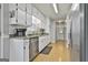 Well-lit kitchen featuring stainless steel appliances, granite countertops, and ample cabinet space at 100 Rockland Trl, Sharpsburg, GA 30277