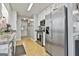 Functional kitchen with stainless steel refrigerator and complementary granite countertops at 100 Rockland Trl, Sharpsburg, GA 30277
