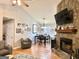 Cozy living room with stone fireplace, hardwood floors, and comfortable seating area at 100 Rockland Trl, Sharpsburg, GA 30277